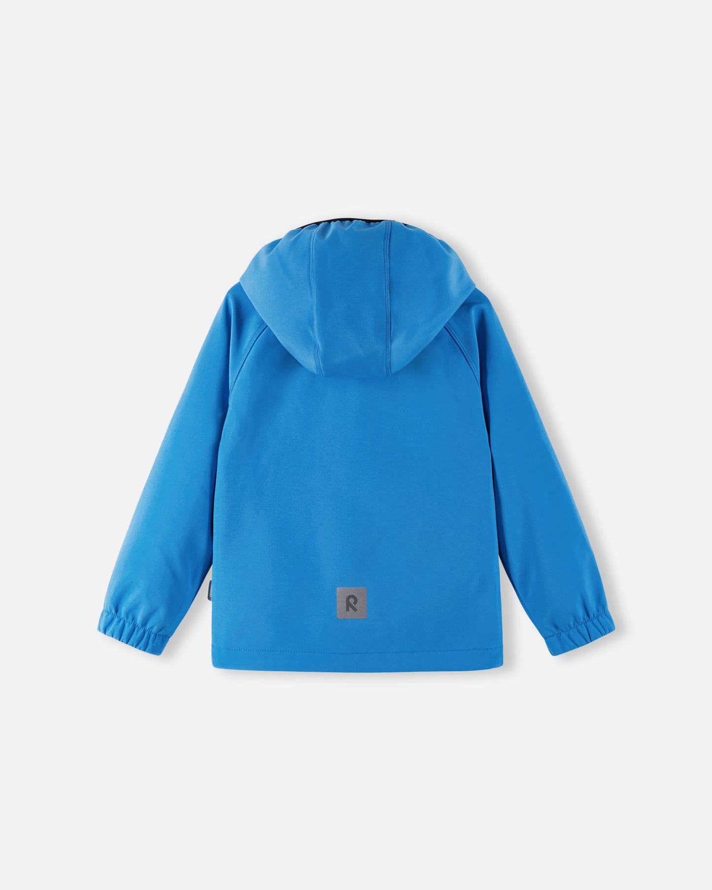 Back view of the cool blue Reima Vantti kids' softshell jacket, showcasing a comfortable active fit with raglan sleeves, a protective hood, and a highly visible reflective safety patch at the lower hem.