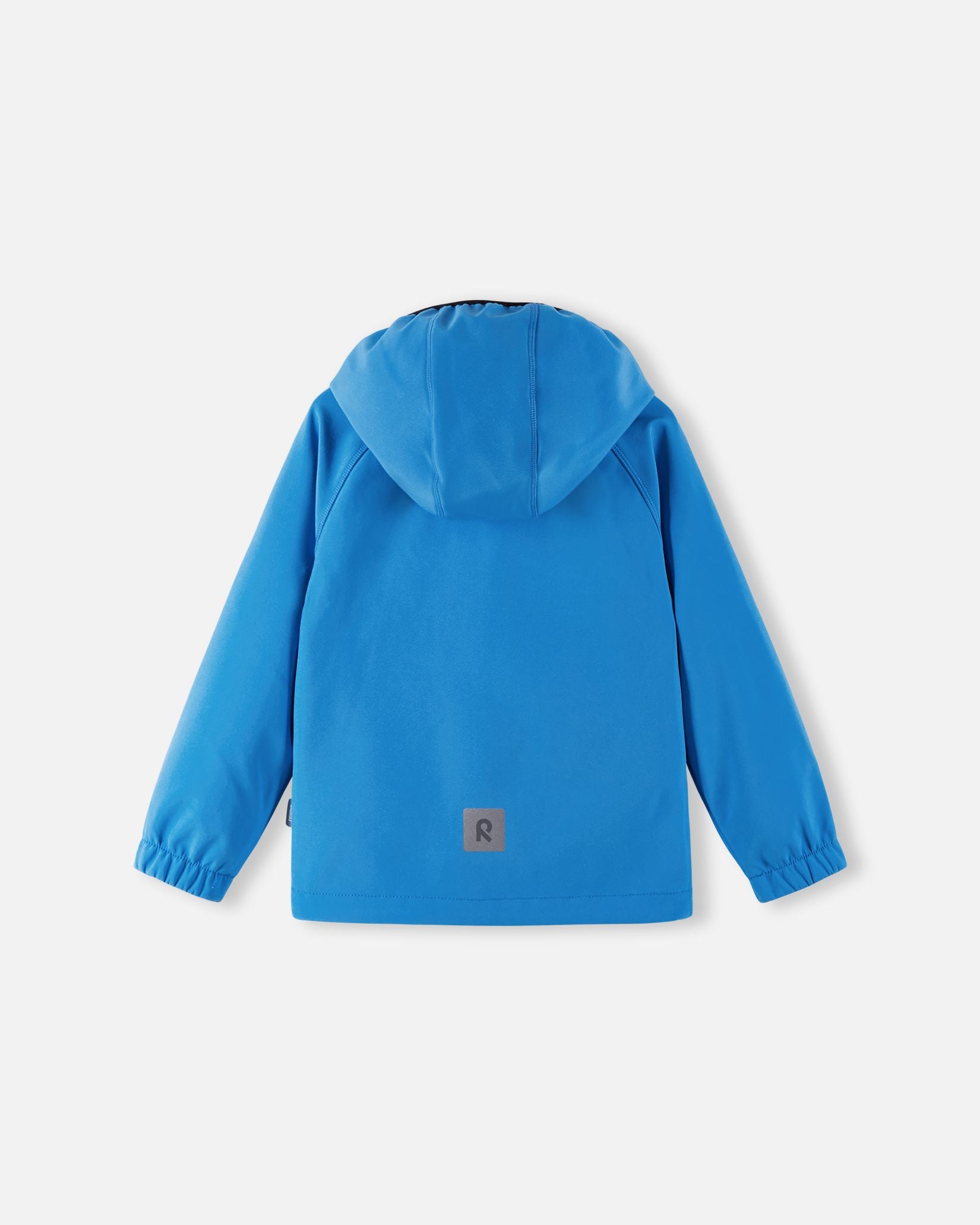 Back view of the cool blue Reima Vantti kids' softshell jacket, showcasing a comfortable active fit with raglan sleeves, a protective hood, and a highly visible reflective safety patch at the lower hem.