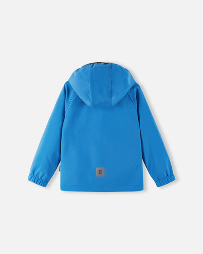 Back view of the cool blue Reima Vantti kids' softshell jacket, showcasing a comfortable active fit with raglan sleeves, a protective hood, and a highly visible reflective safety patch at the lower hem.