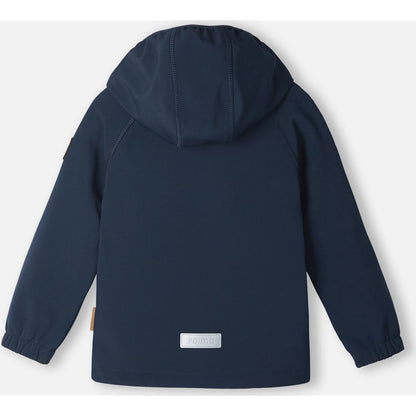 Back view of the navy blue Reima Vantti kids' softshell jacket, showcasing a comfortable active fit, raglan sleeves for mobility, and a highly visible reflective safety patch at the lower hem.