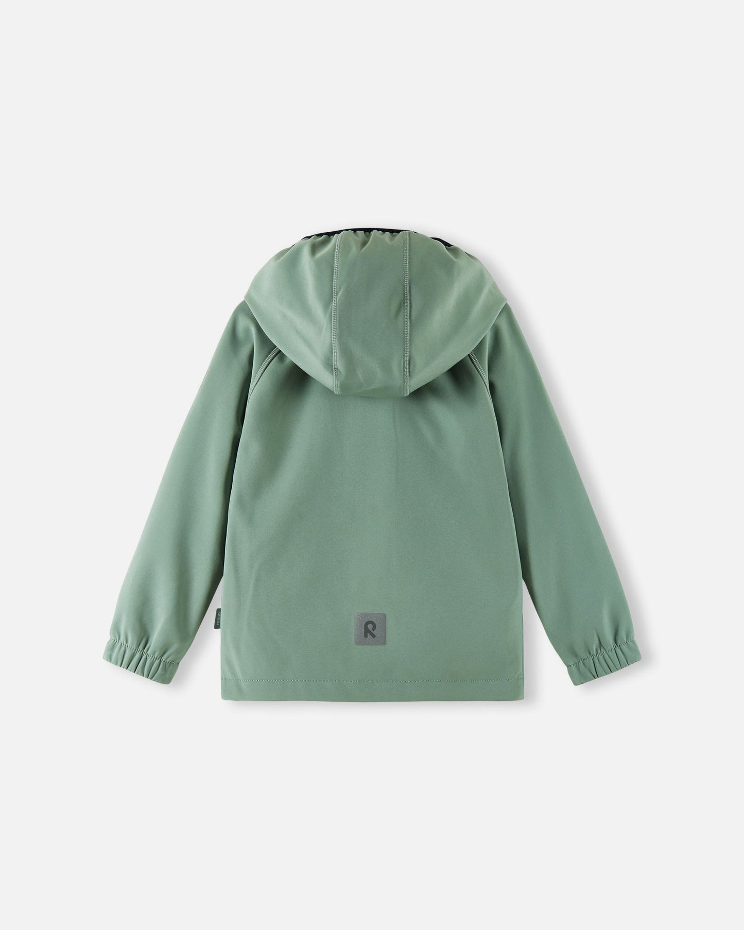 Back view of the stone green Reima Vantti kids' softshell jacket, showcasing a comfortable raglan sleeve design, a protective hood, and a highly visible reflective safety patch at the lower hem.