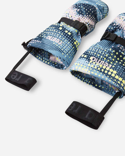 Angled flat lay view of the frozen blue Reima Vanukko children's ski mittens, emphasizing the wide gauntlet cuff opening that easily layers over jackets, adjustable wrist straps, and elastic safety wrist leashes to prevent dropping gear on the slopes.