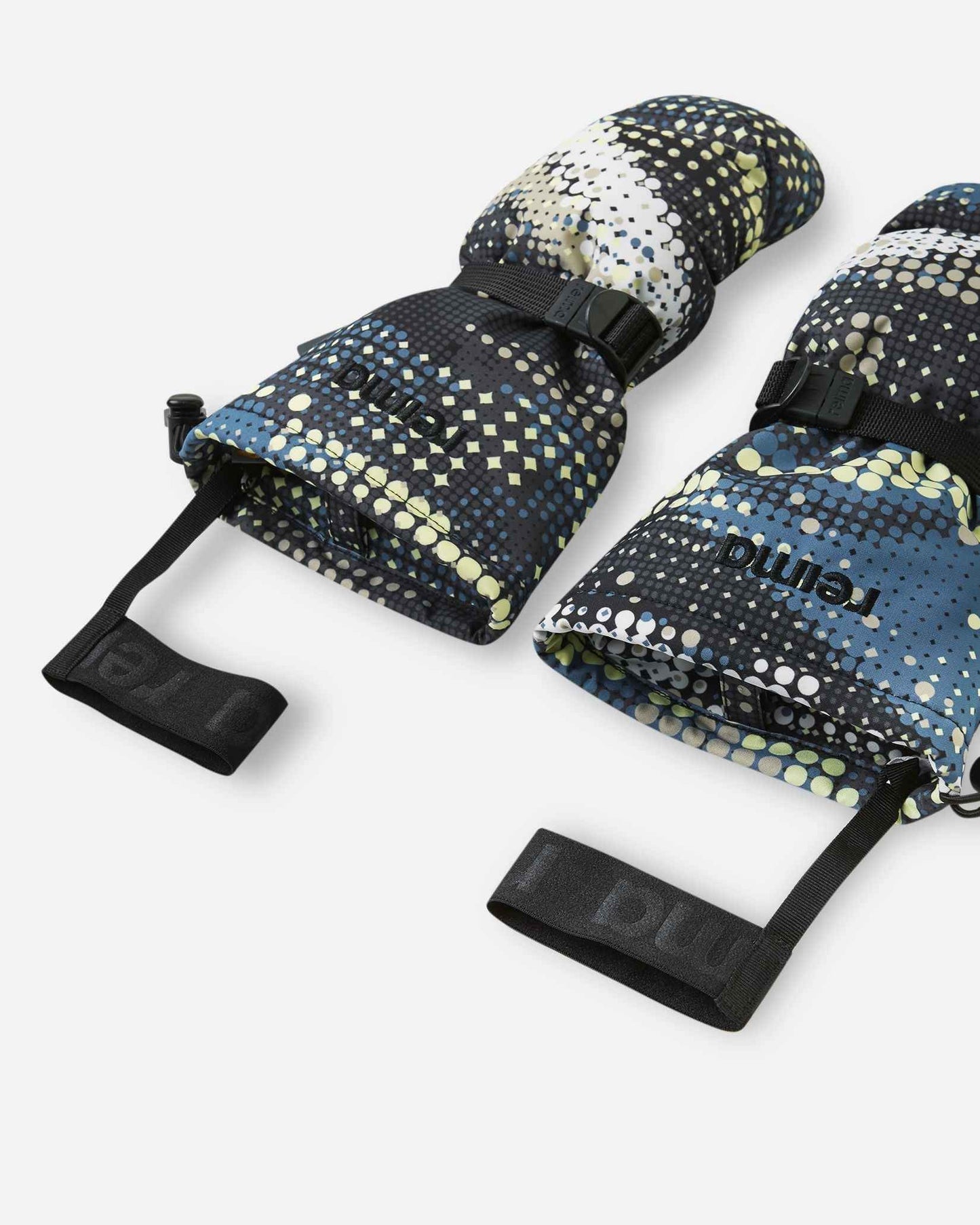 Angled flat lay view of the open cuffs on the soft black Reima Vanukko children's ski mittens, showing the wide opening for easy layering over winter coats and the attached elastic safety wrist leashes to prevent lost mittens.