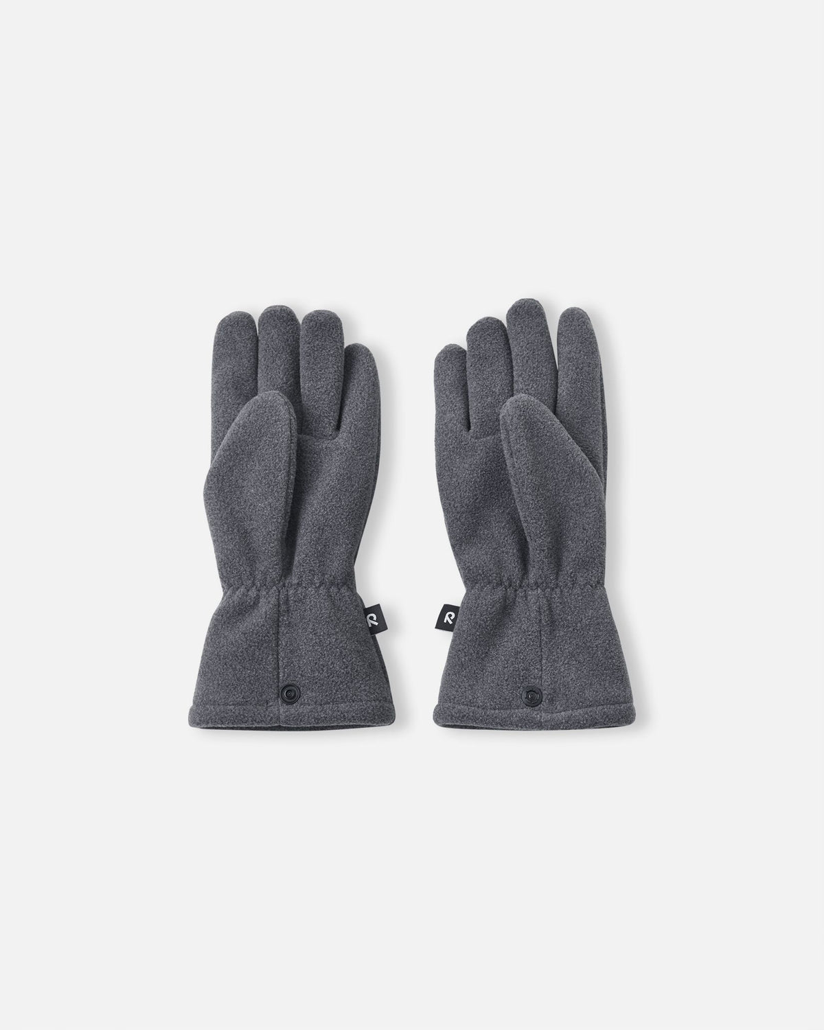 Palm side view of the Reima Varmin children's fleece gloves in a dark grey black melange, featuring a comfortable five-finger design, gathered wrists to keep out cold drafts, and connecting snap buttons at the hem.