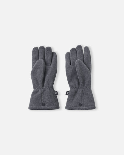 Palm side view of the Reima Varmin children's fleece gloves in a dark grey black melange, featuring a comfortable five-finger design, gathered wrists to keep out cold drafts, and connecting snap buttons at the hem.