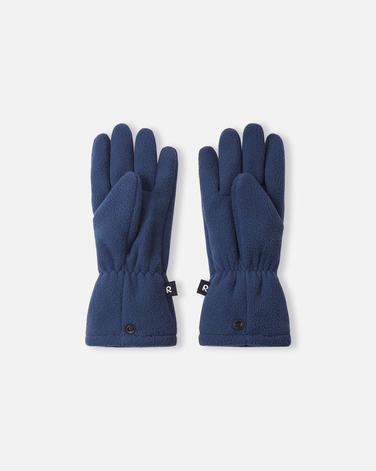 Palm side view of the Reima Varmin children's fleece gloves in navy blue, showcasing the comfortable finger design, gathered elastic wrists, and connecting snap buttons at the bottom hem.