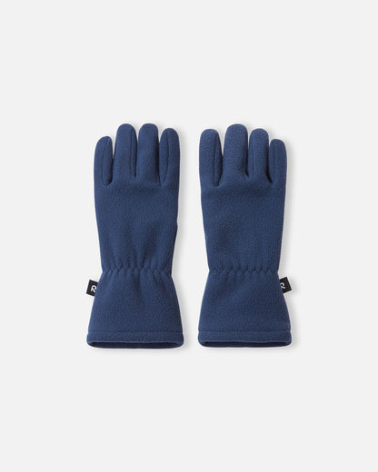 Top view of a pair of navy blue Reima Varmin kids' fleece gloves, featuring soft, warm fabric, a black Reima logo tag on the side, and elasticated wrists for a snug winter fit.
