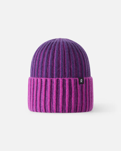 Front view of the Reima Veikee kids winter beanie in a vibrant plum purple and pink vertical stripe pattern, featuring a wide fold-over ribbed cuff and made from a warm 70% wool and 30% polyamide blend for cold weather protection.