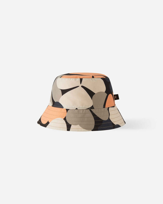 Front view of the Reima Viehe kids' UPF 50+ sunproof reversible bucket hat in apricot, featuring a bold oversized floral clover print in beige, orange, and navy blue.
