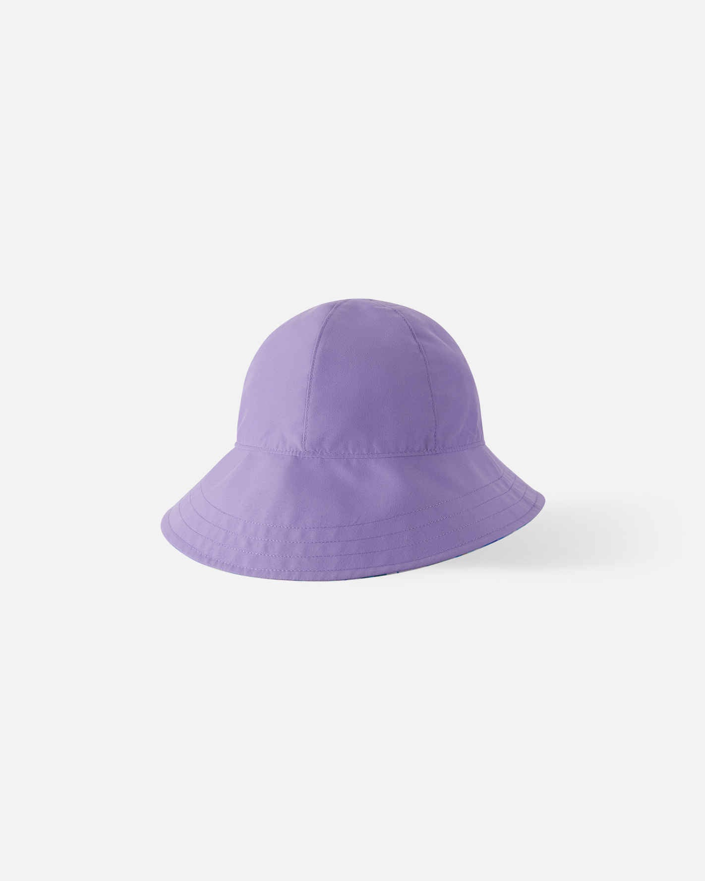 Reverse side of the Reima Viiri kids' fresh blue sunhat, featuring a solid pastel purple design that offers versatile styling options while maintaining maximum UPF 50+ UV protection.