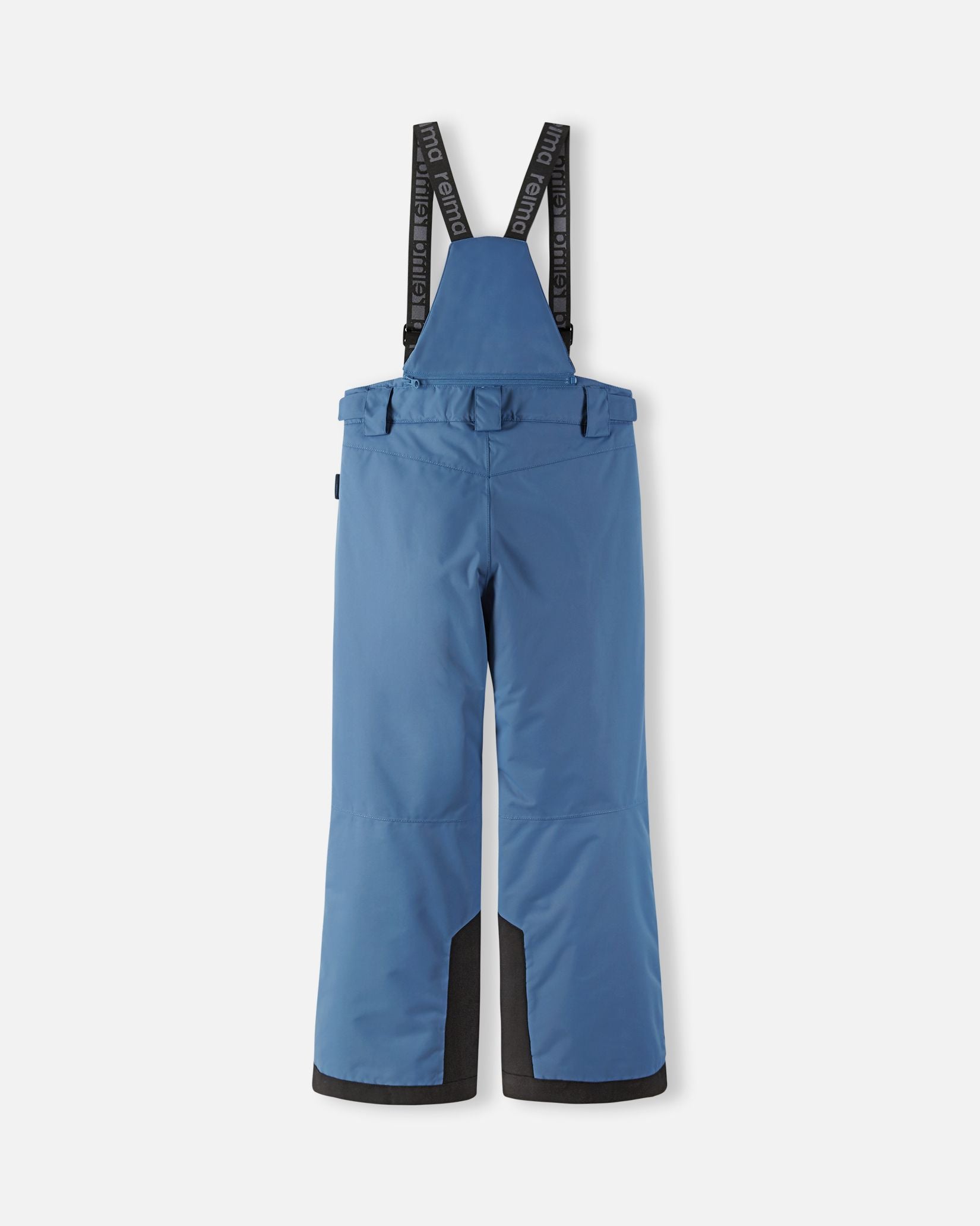 Back flat lay view of the blue ocean Reima Wingon kids' ski pants, showcasing the high-back coverage, elastic waistband, and heavy-duty black reinforced lower legs built for rugged winter sports.