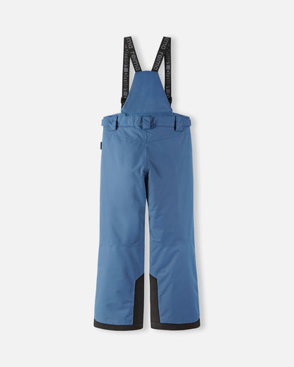 Back flat lay view of the blue ocean Reima Wingon kids' ski pants, showcasing the high-back coverage, elastic waistband, and heavy-duty black reinforced lower legs built for rugged winter sports.