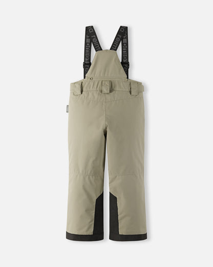 Back flat lay view of the earthy beige Reima Wingon kids' ski pants, showcasing the high-back coverage, elastic waistband, and heavy-duty black reinforced lower legs built for rugged winter sports.