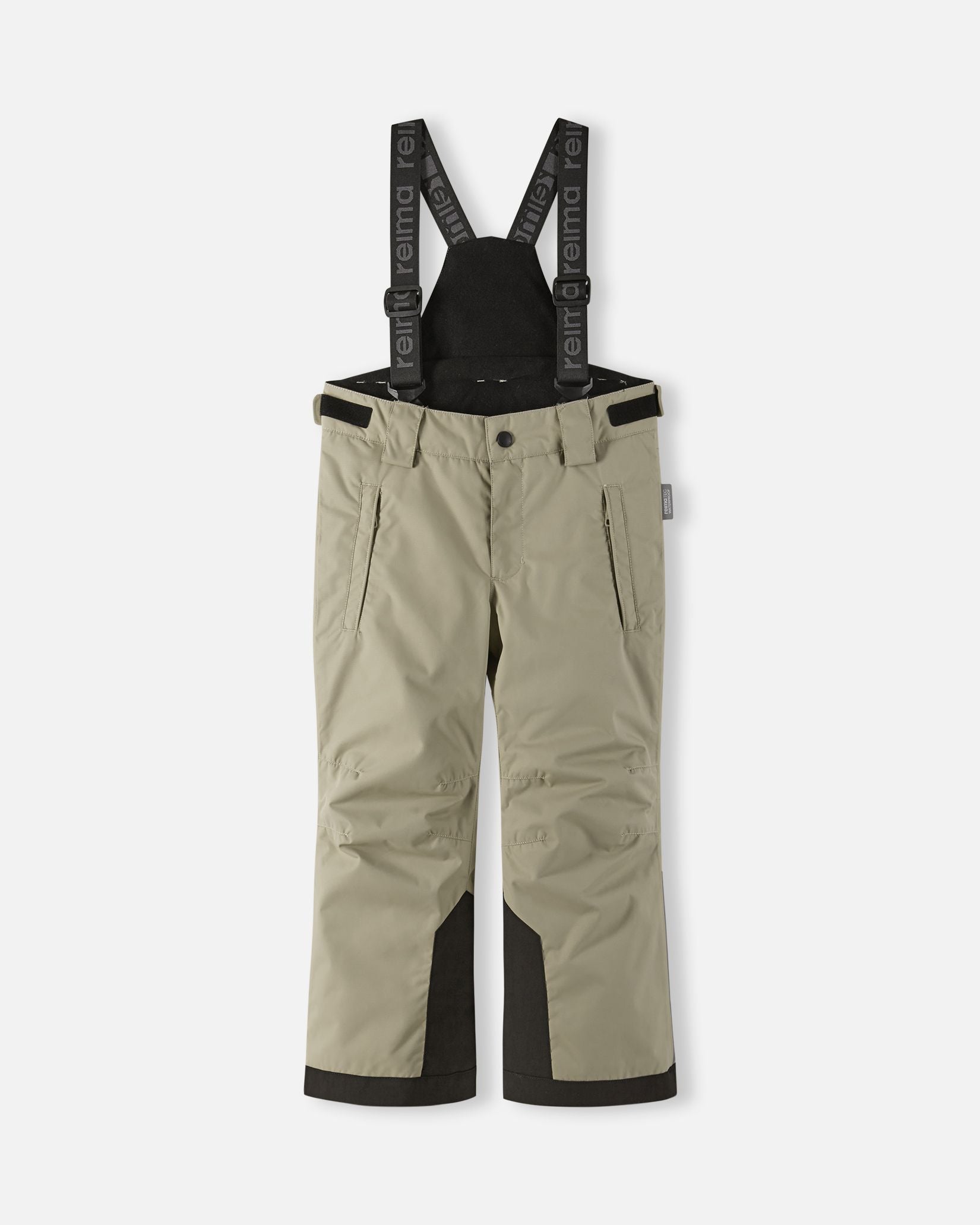 Front flat lay view of the earthy beige Reima Wingon kids' winter ski pants, featuring adjustable Reima-branded black suspenders, zippered hip pockets, and durable black reinforced hems designed for alpine skiing.