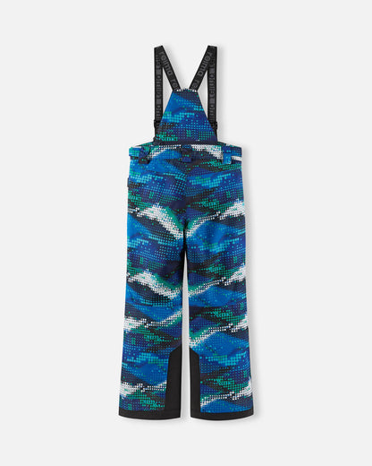 Back flat lay view of the twilight blue geometric patterned Reima Wingon kids' ski pants, showcasing the high-back coverage, elastic waistband, and heavy-duty black reinforced lower legs built for rugged winter sports.
